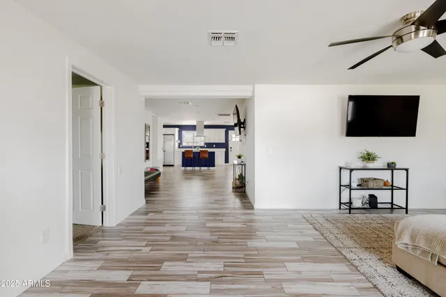 a view of a livingroom with furniture and a flat screen tv