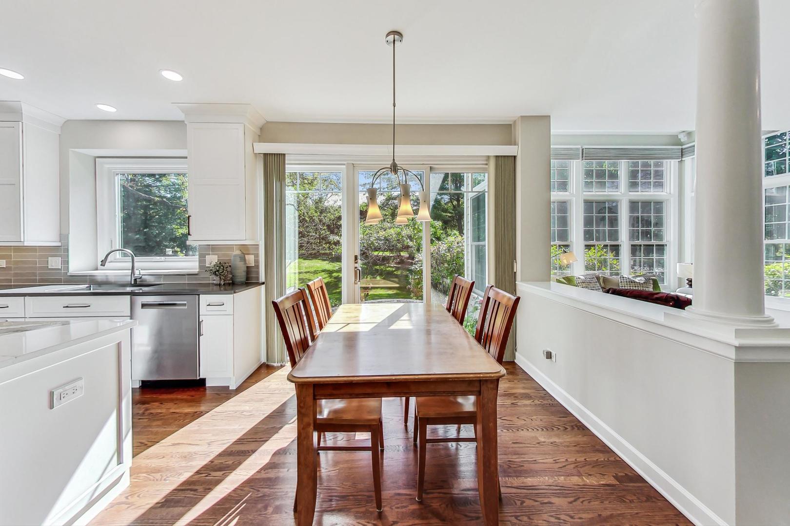 1429 Castleton Road Libertyville, IL 60048 - Photo 11 of 30 a dining room with furniture a chandelier and wooden floor