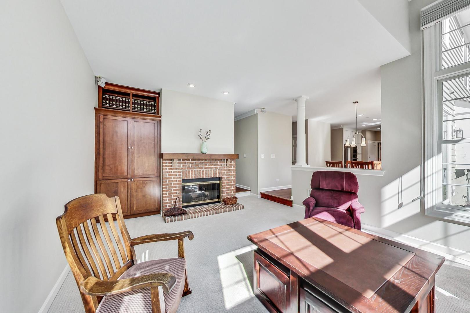 1429 Castleton Road Libertyville, IL 60048 - Photo 13 of 30 a living room with furniture fireplace and dining table