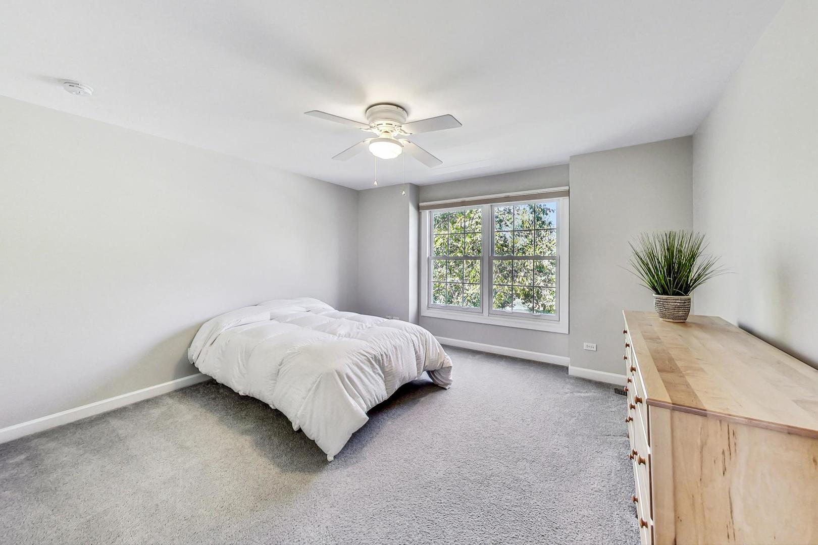 1429 Castleton Road Libertyville, IL 60048 - Photo 19 of 30 a bedroom with a bed and a window