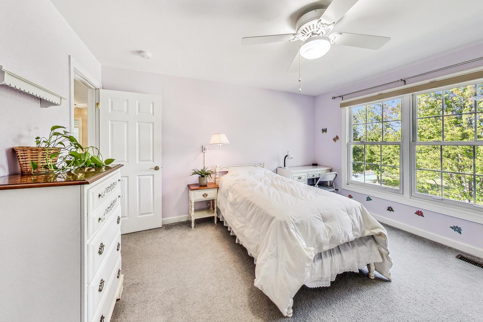1429 Castleton Road Libertyville, IL 60048 - Photo 20 of 30 a spacious bedroom with a bed and a window