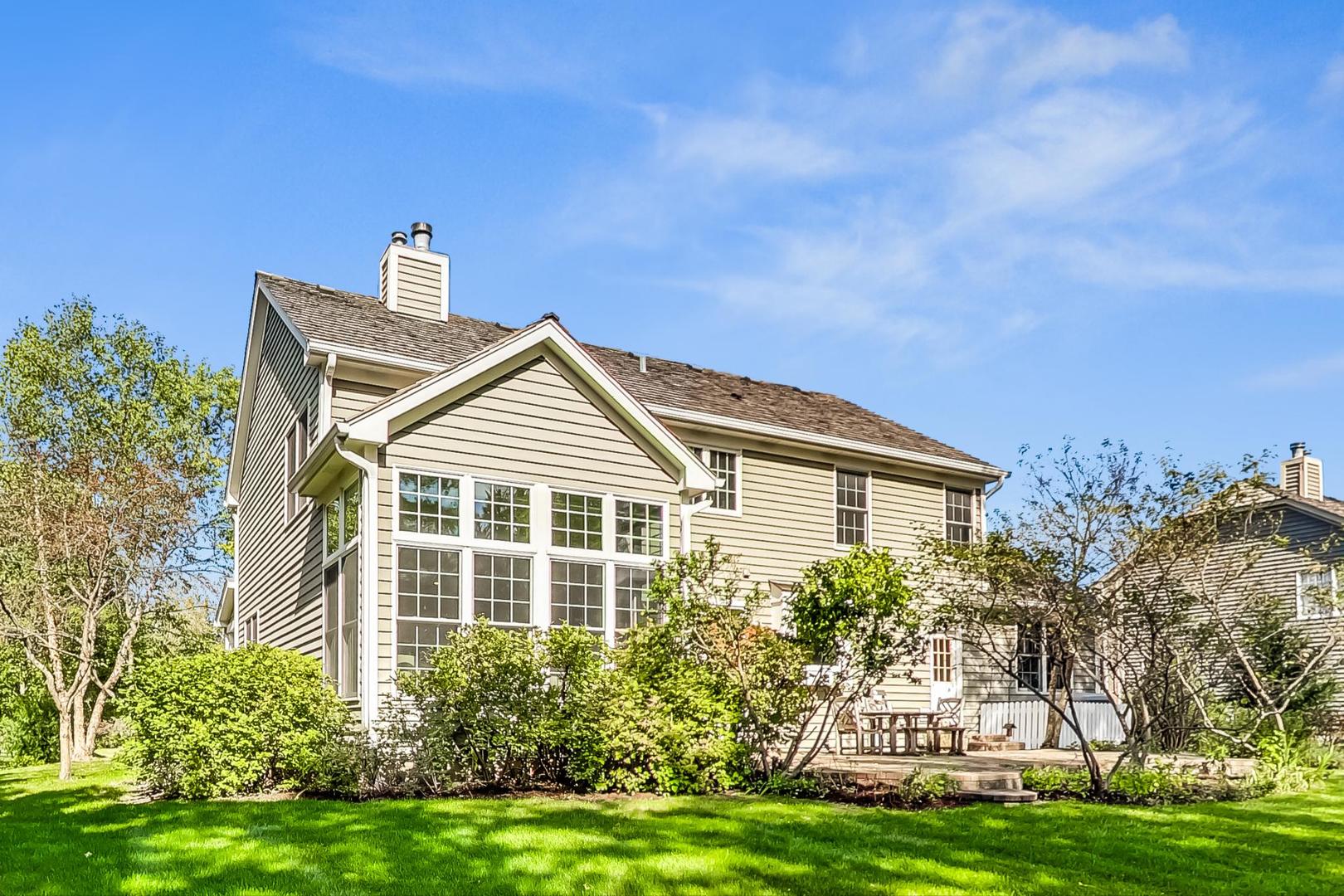 1429 Castleton Road Libertyville, IL 60048 - Photo 26 of 30 a front view of a house with a garden