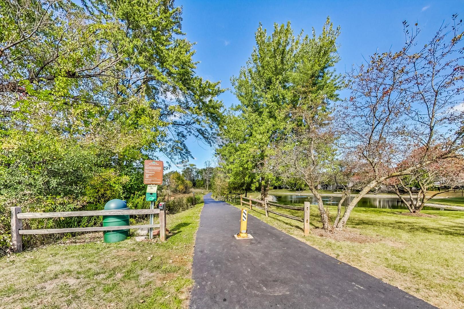 1429 Castleton Road Libertyville, IL 60048 - Photo 29 of 30 a view of a swimming pool with a bench and trees around