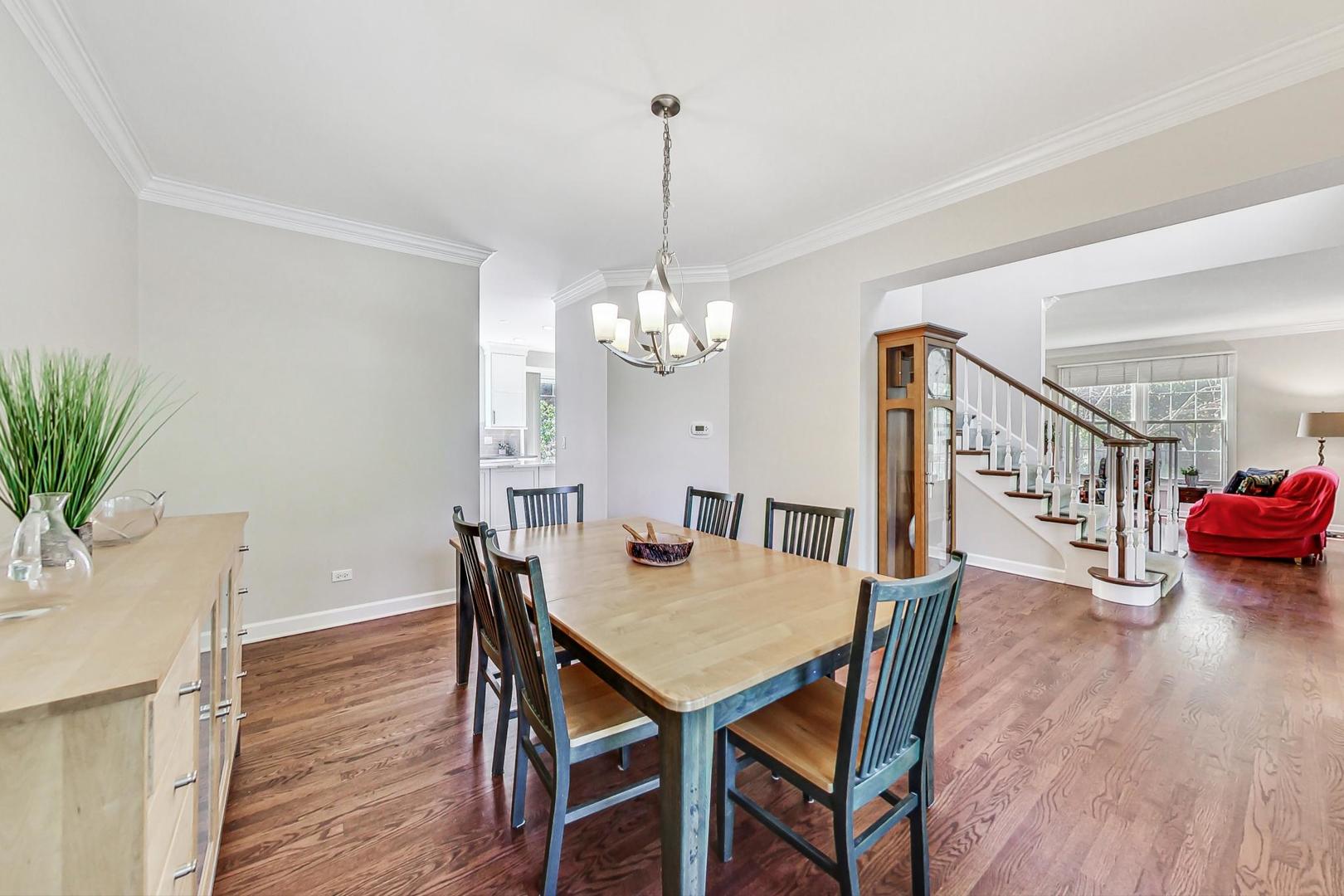 1429 Castleton Road Libertyville, IL 60048 - Photo 6 of 30 a view of a dining room with furniture wooden floor and chandelier