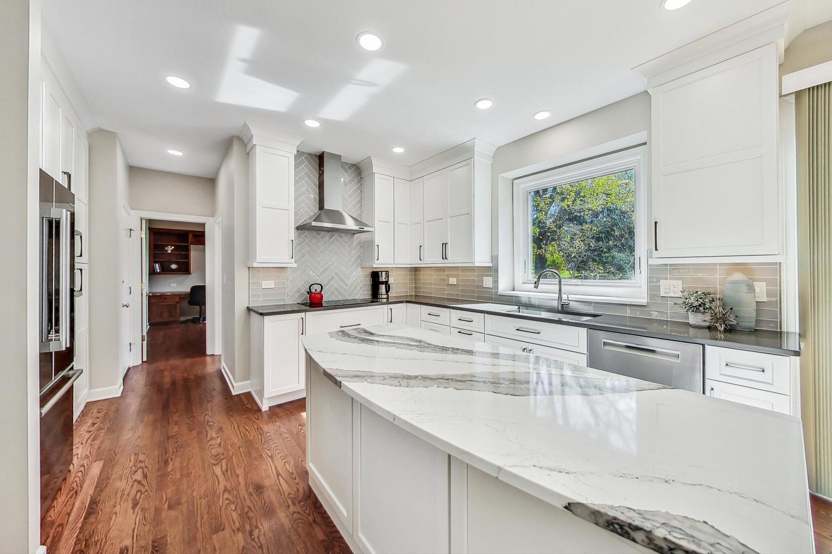 1429 Castleton Road Libertyville, IL 60048 - Photo 7 of 30 a large kitchen with stainless steel appliances granite countertop a lot of counter space and a wooden floors