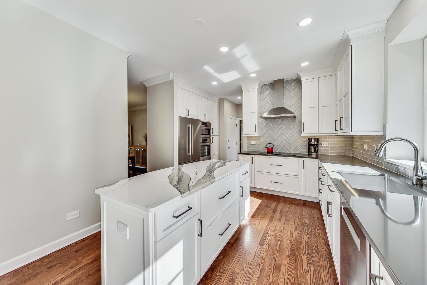 1429 Castleton Road Libertyville, IL 60048 - Photo 8 of 30 a large white kitchen with stainless steel appliances