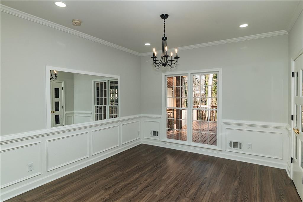 525 Rams Way Tucker, GA 30084 - Photo 15 of 41 a view of an empty room with a window and wooden floor