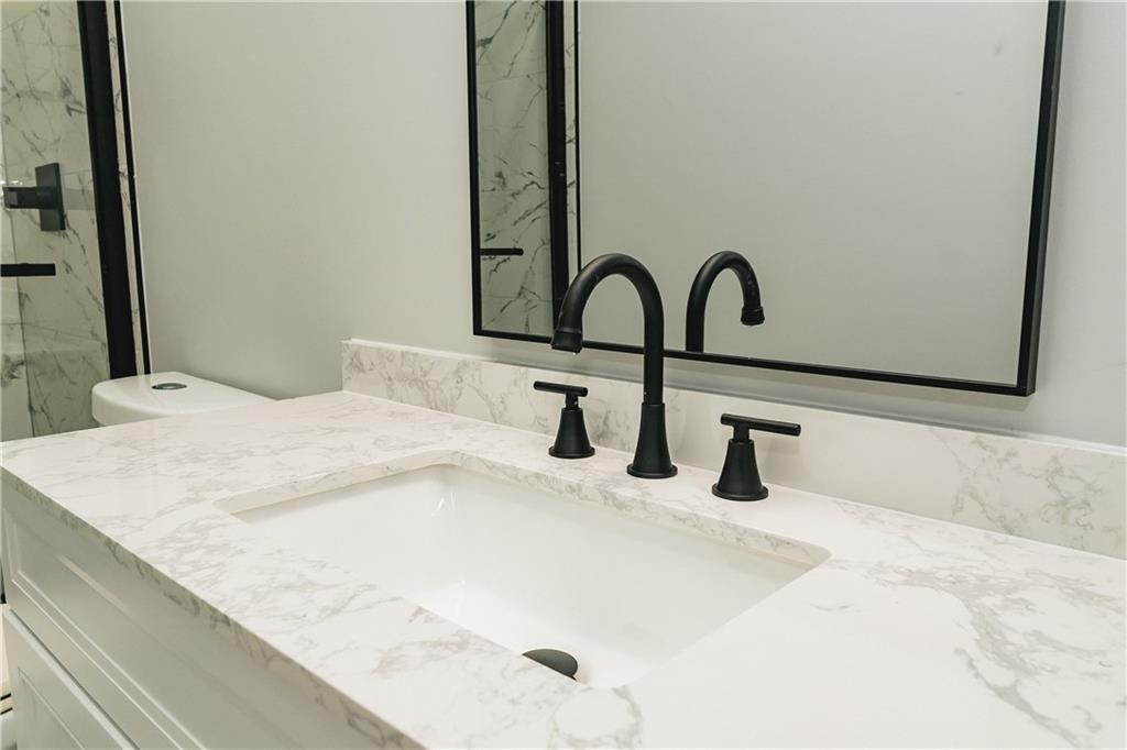 525 Rams Way Tucker, GA 30084 - Photo 33 of 41 a bathroom with a sink and a bed