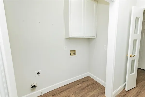 a view of bathroom with wooden floor
