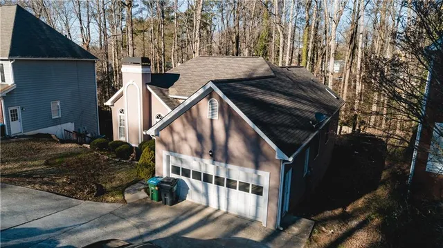 a view of an and white house with a yard