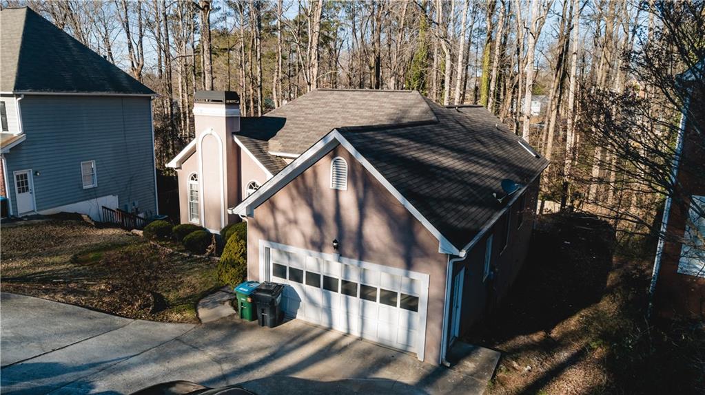 525 Rams Way Tucker, GA 30084 - Photo 5 of 41 a view of an and white house with a yard