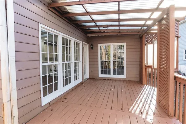 a view of a porch with wooden floor and city view