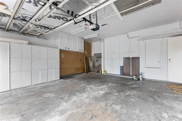 a view of empty room with a garage