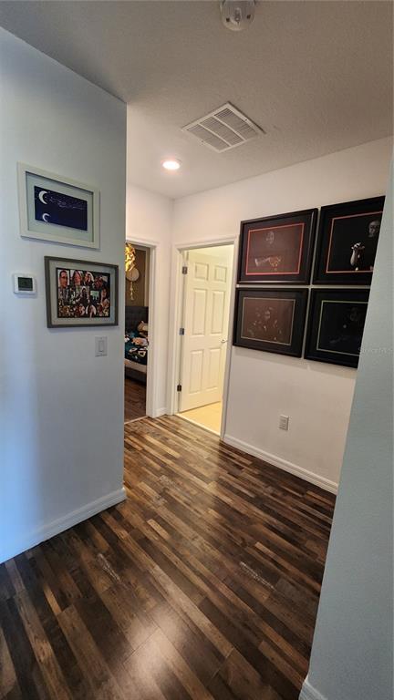 4540 Lake Russell Road Kissimmee, FL 34746 - Photo 17 of 35 a view of a refrigerator in kitchen and wooden floor