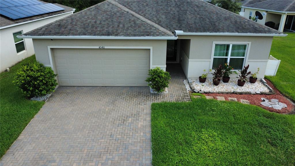 4540 Lake Russell Road Kissimmee, FL 34746 - Photo 2 of 35 a view of a house with a garden