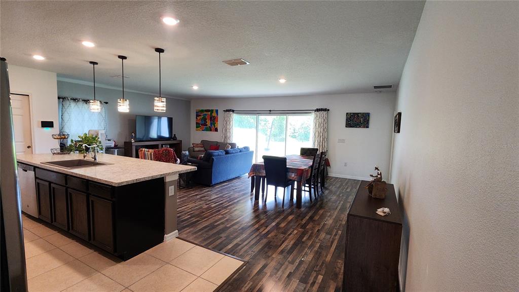 4540 Lake Russell Road Kissimmee, FL 34746 - Photo 23 of 35 a kitchen with stainless steel appliances granite countertop a sink a stove and a refrigerator