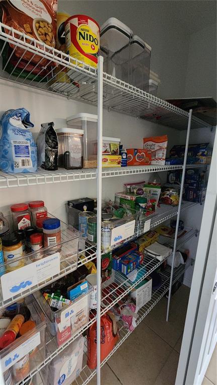 4540 Lake Russell Road Kissimmee, FL 34746 - Photo 27 of 35 a store room with lots of different colored cloths