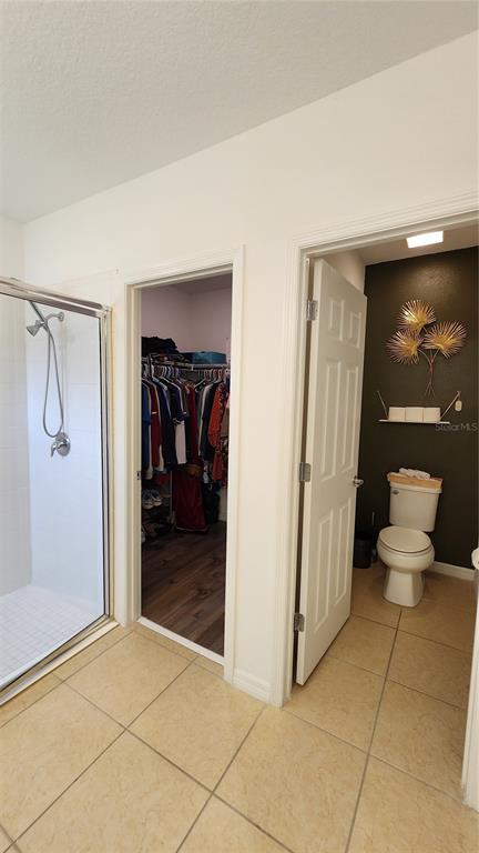 4540 Lake Russell Road Kissimmee, FL 34746 - Photo 32 of 35 a view of a hallway with bathroom and glass door