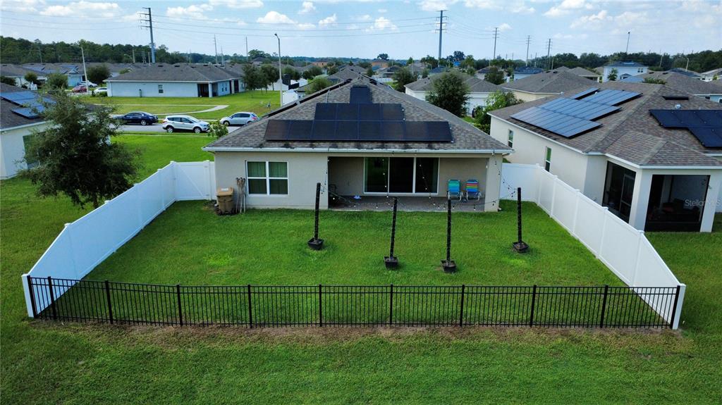 4540 Lake Russell Road Kissimmee, FL 34746 - Photo 4 of 35 a view of a white house next to a yard with plants