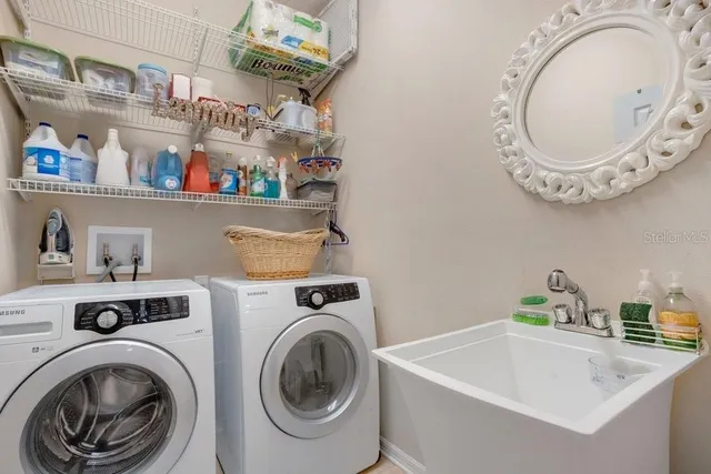 a view of washer and dryer in a utility room