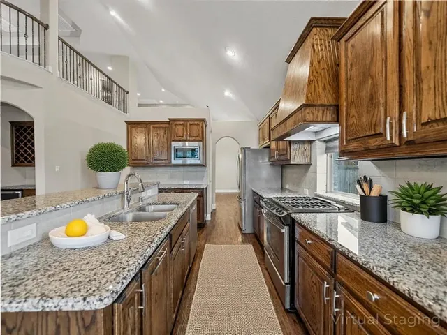 a view of a kitchen with furniture and a ceiling fan