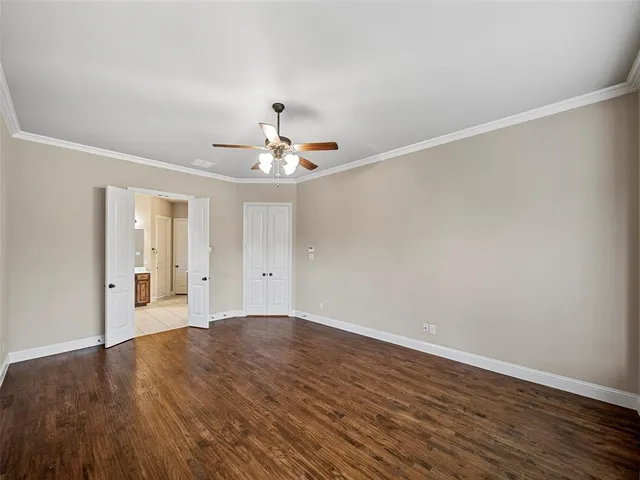 a spacious bathroom with a sink double vanity granite tub and a mirror