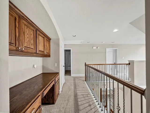 a bedroom with a bed and a lamp next to a window