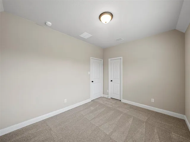 a bathroom with a sink a toilet a mirror and shower