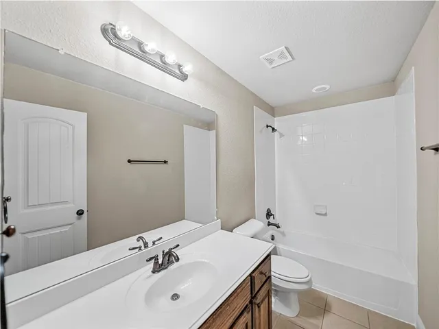 a view of a house with roof deck front of house