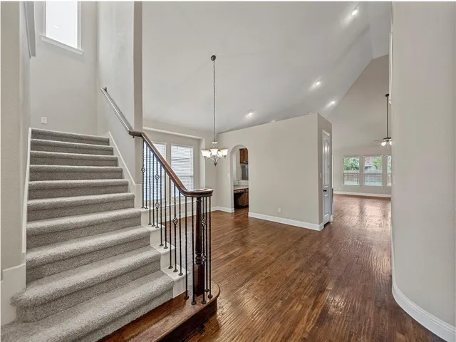 a view of an entryway with wooden floor