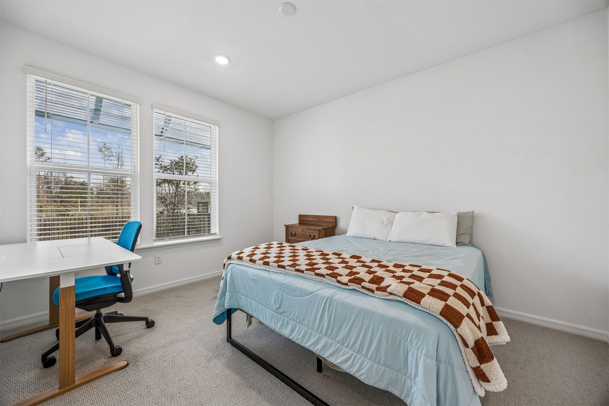 236 Hawthorn Park Circle Yulee, FL 32097 - Photo 12 of 28 a bedroom with a bed chair and a window