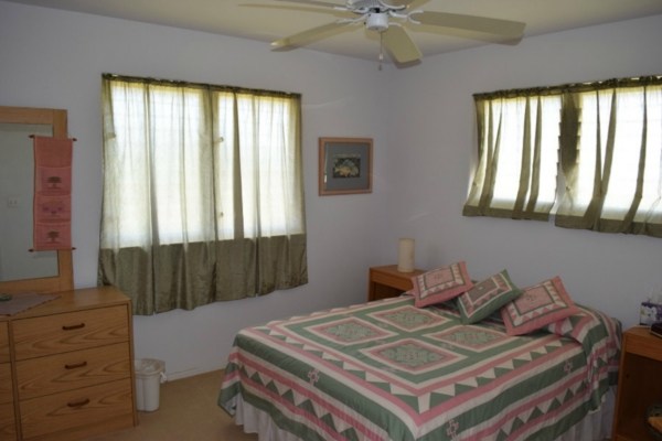 4790 Pelehu Road Kapaa, HI 96746 - Photo 11 of 17 a bedroom with a bed and a window