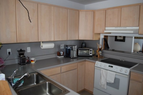 4790 Pelehu Road Kapaa, HI 96746 - Photo 5 of 17 a kitchen with a sink cabinets and appliances