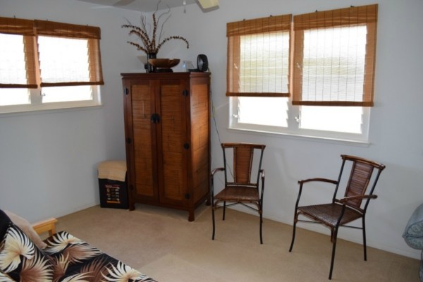 4790 Pelehu Road Kapaa, HI 96746 - Photo 10 of 17 a bedroom with a bed and a window