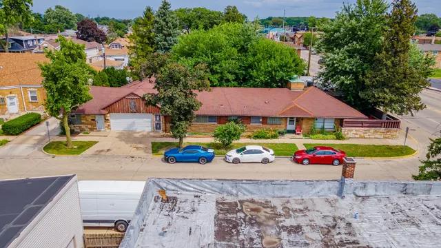 an aerial view of a house with outdoor space