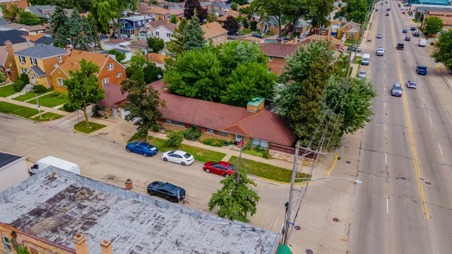 an aerial view of a house with outdoor space
