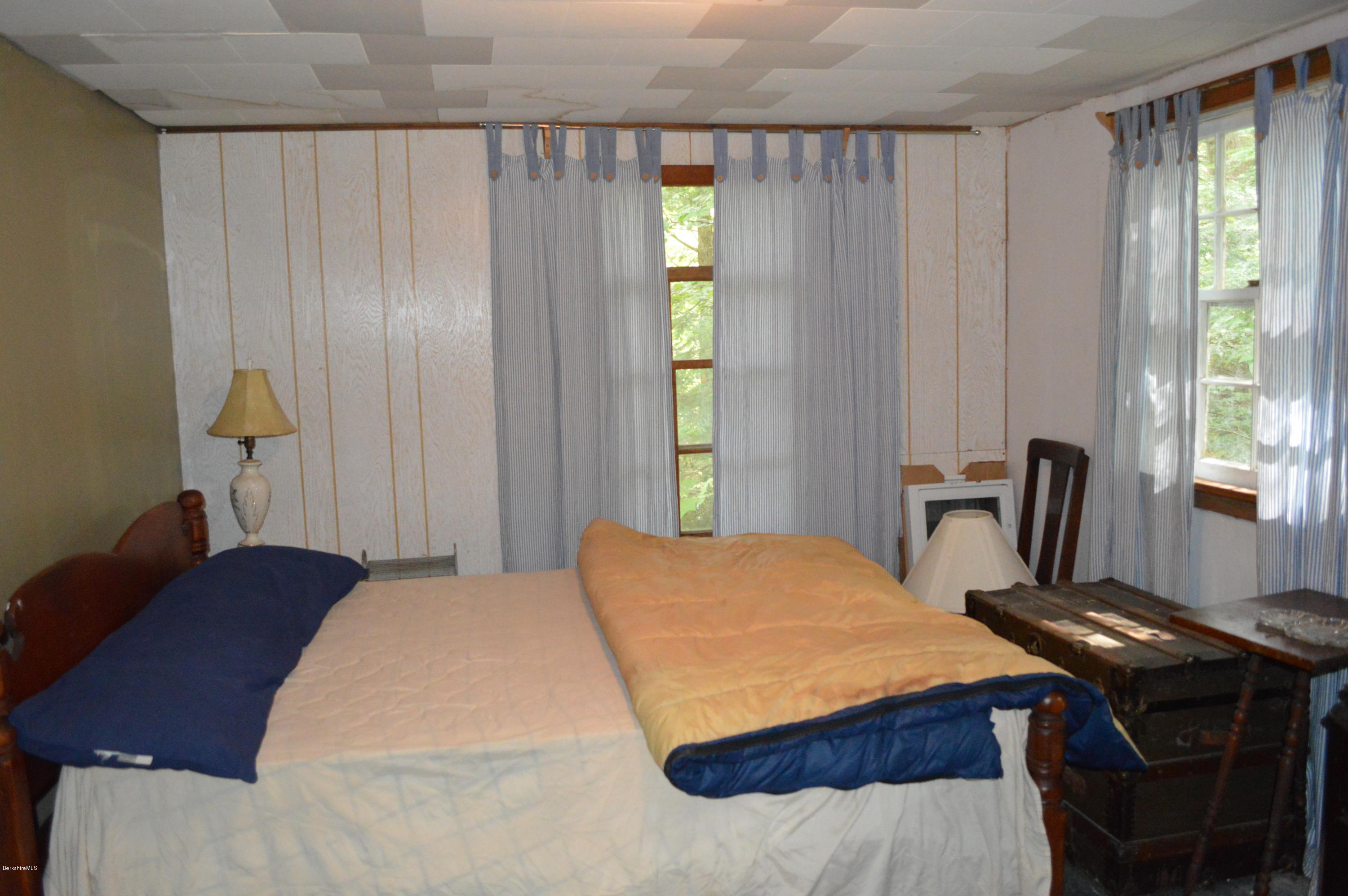34 Highland Road Becket, MA 01223 - Photo 15 of 35 a bedroom with a bed and a window
