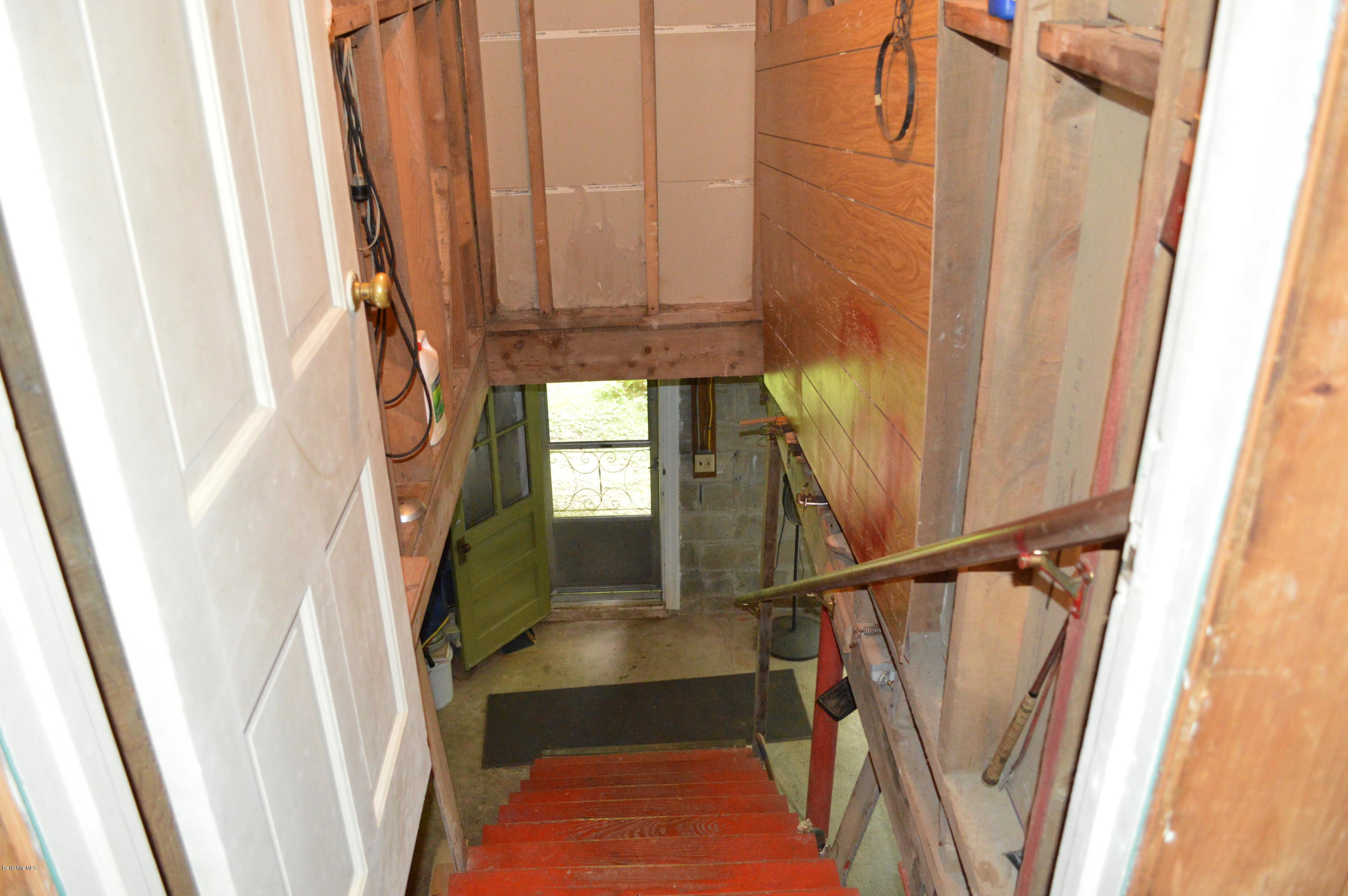 34 Highland Road Becket, MA 01223 - Photo 22 of 35 a view of a door with wooden floor and stairs