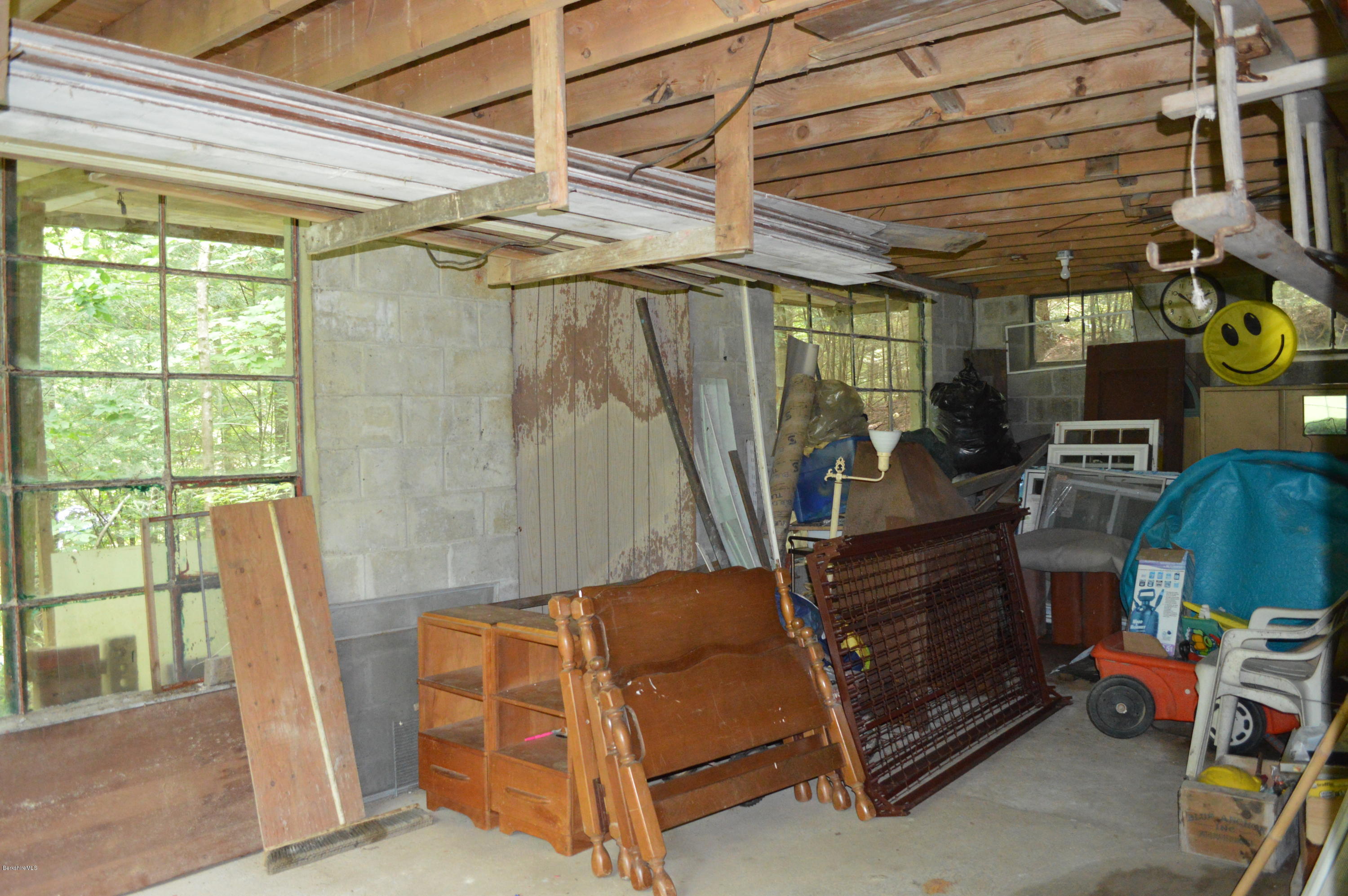 34 Highland Road Becket, MA 01223 - Photo 23 of 35 a room with lots of furniture and a window