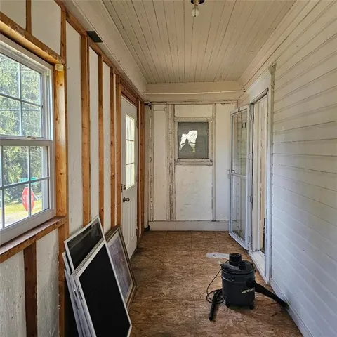 a bathroom with a granite countertop sink and cabinets