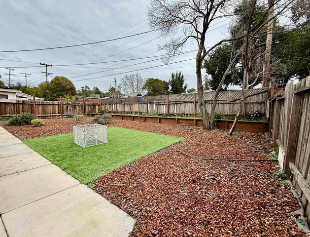 a view of a chair and tables in the patio