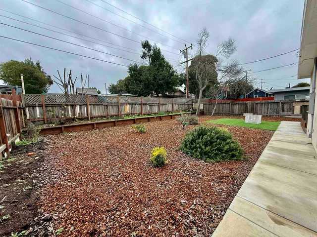 a view of a garden with sitting area