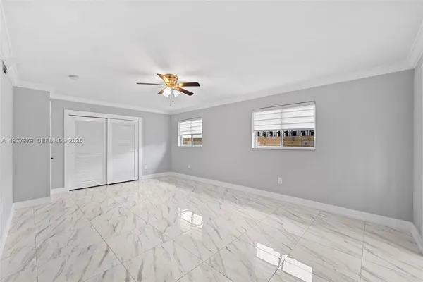 a view of an empty room with a window