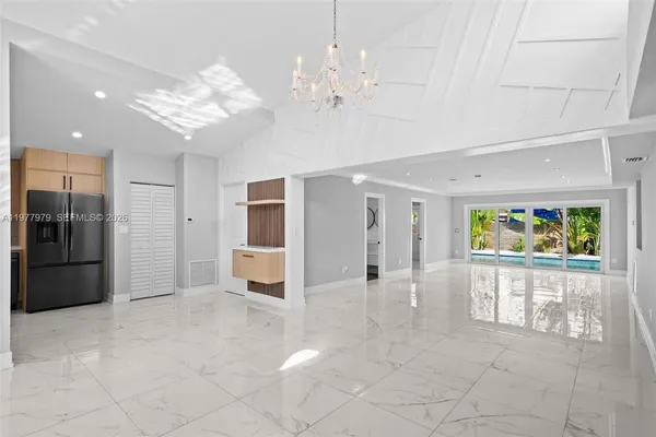 a view of a hallway with a chandelier