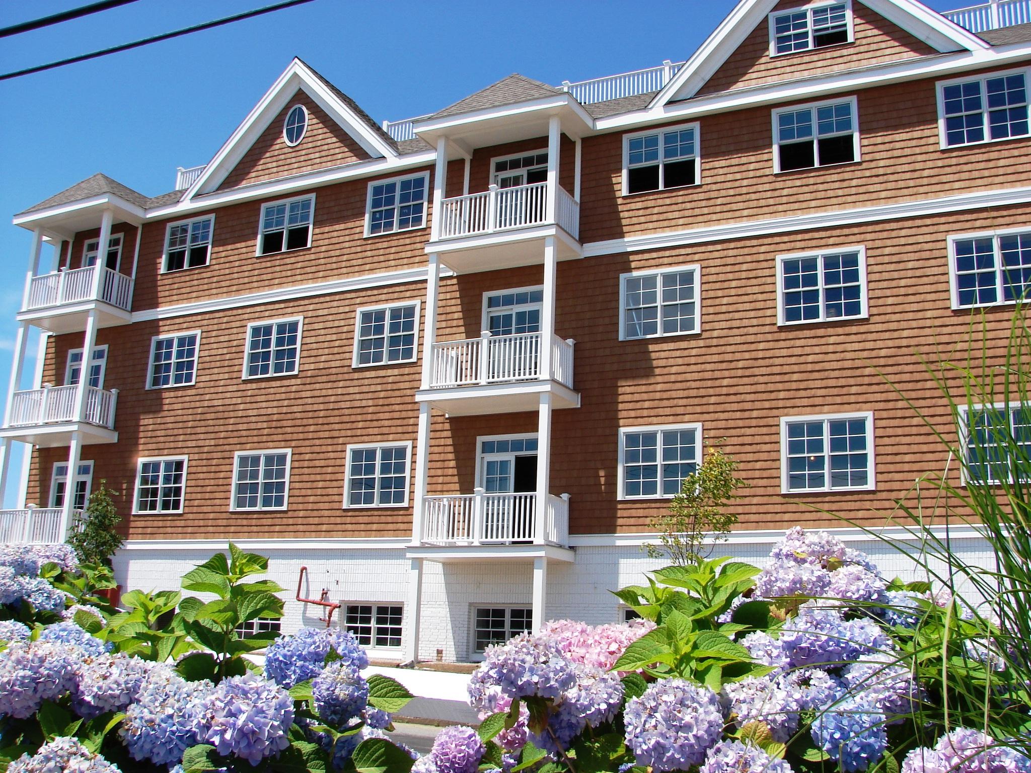 89 Lewis Bay Road, Unit 209 Hyannis, MA 02601 - Photo 4 of 5 a front view of a multi story residential apartment building