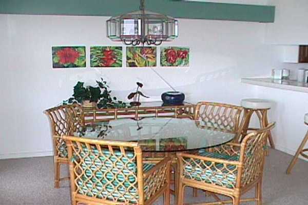 1568 Pe'e Road, Unit 212 Koloa, HI 96756 - Photo 8 of 25 a view of a dining room with furniture