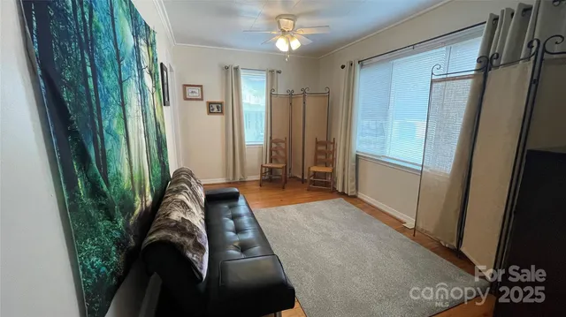 a bathroom with a toilet a sink and a window