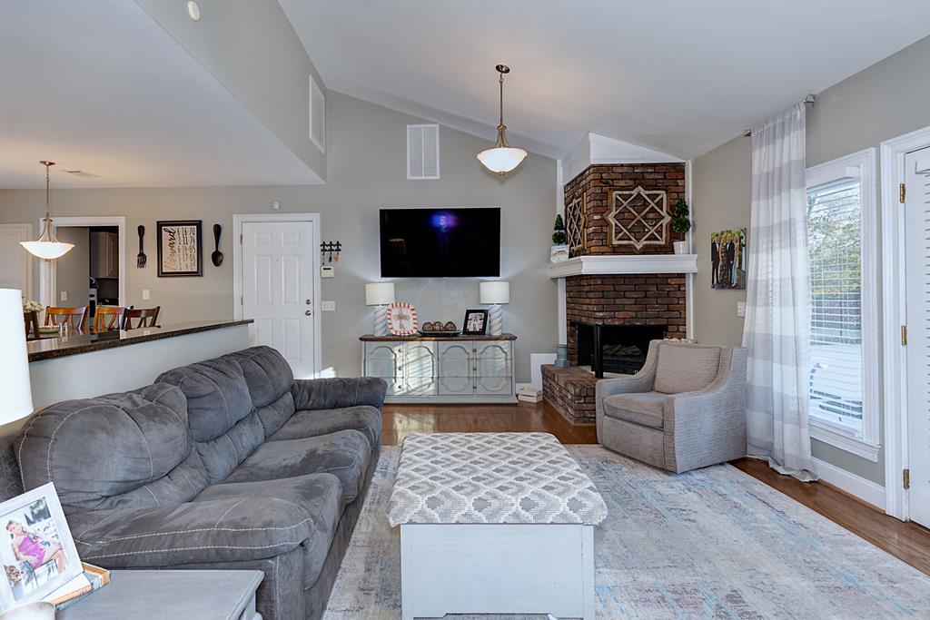 2008 Stark Avenue Columbus, GA 31906 - Photo 11 of 32 a living room with furniture a flat screen tv and a fireplace