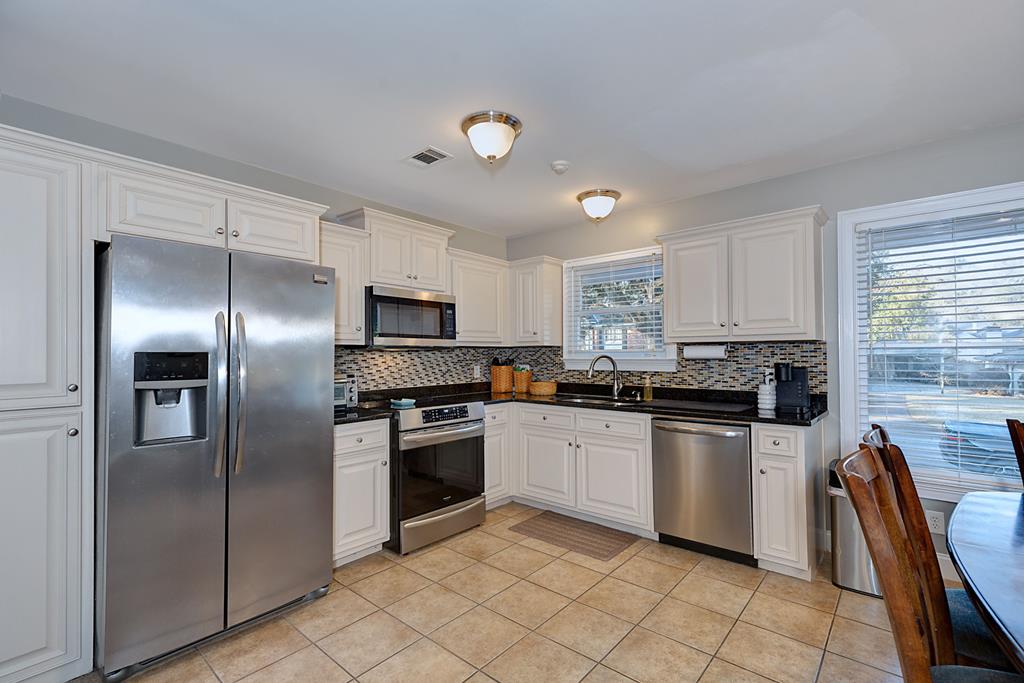 2008 Stark Avenue Columbus, GA 31906 - Photo 15 of 32 a kitchen with granite countertop a refrigerator and a sink