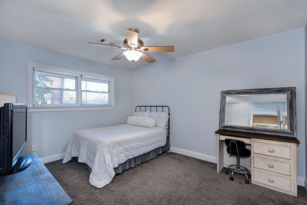2008 Stark Avenue Columbus, GA 31906 - Photo 17 of 32 a bedroom with a bed and a flat tv screen on the dresser